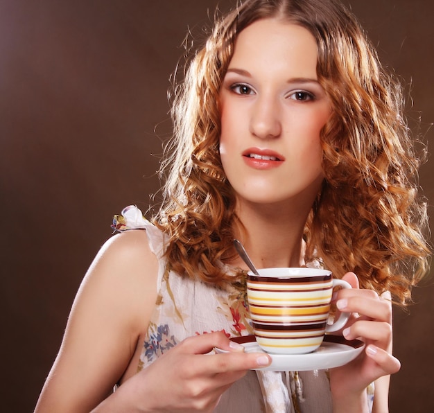 Beautiful Girl Drinking Tea or Coffee