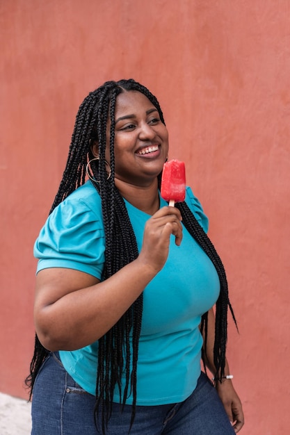 Beautiful girl eating a delicious Popsicle