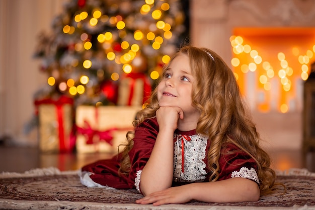 Beautiful girl in a festive dress at home