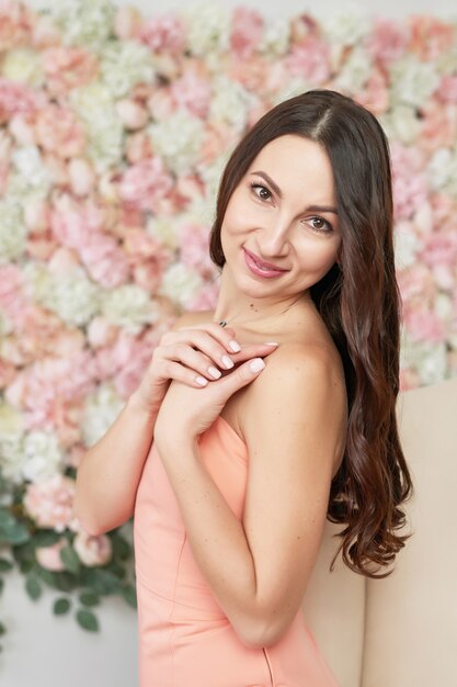 Beautiful girl on floral background.