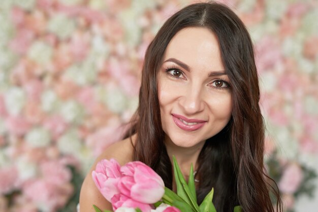 Beautiful girl on floral background.