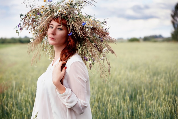 Beautiful  girl in a flower wreath