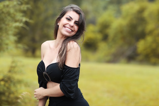 Beautiful girl in the forest in autumn afternoon