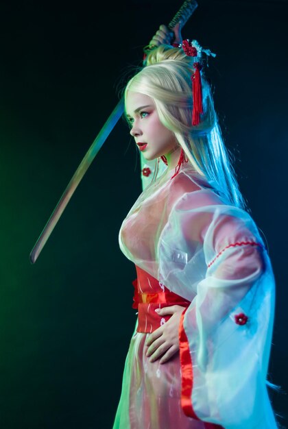 Beautiful girl in a geisha costume with a katana in neon light