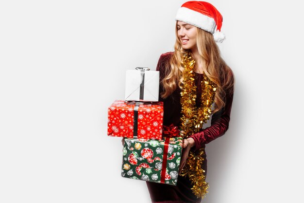 Beautiful girl in the hat of Santa Claus