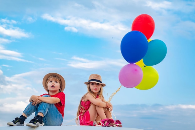 Beautiful girl holding balloons little childs have fun on fresh air happy moments little child enjoy