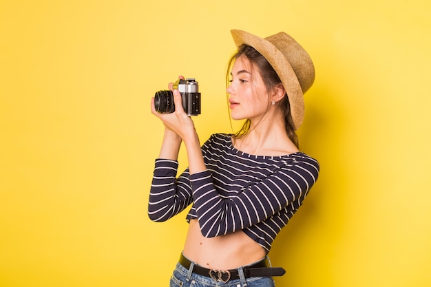 Beautiful girl holding a camera