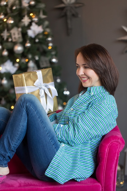 Beautiful girl holding a gift