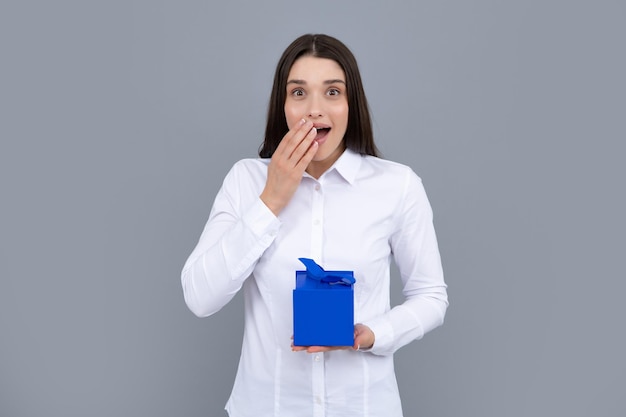 Beautiful girl holding valentines gift Happy birthday celebration woman day christmas Woman holding gift box and rejoices