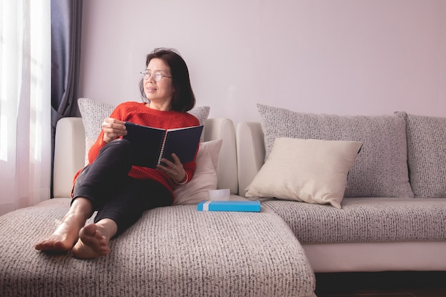 Beautiful girl at home sitting on the couch