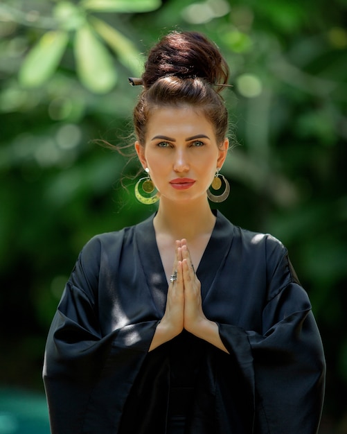 Beautiful girl is engaged in meditation