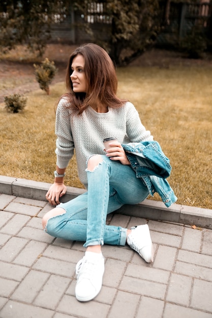 Beautiful girl is resting in the park.