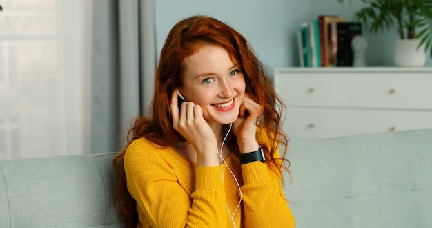 Beautiful girl listening to music on smartphone