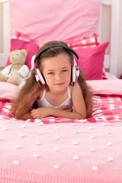 Beautiful girl lying on bed