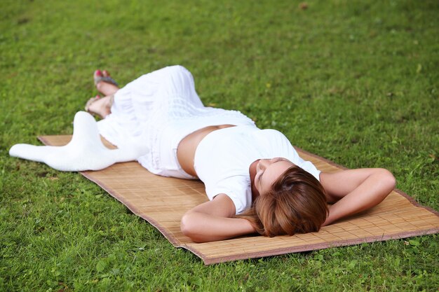 Beautiful girl lying outside