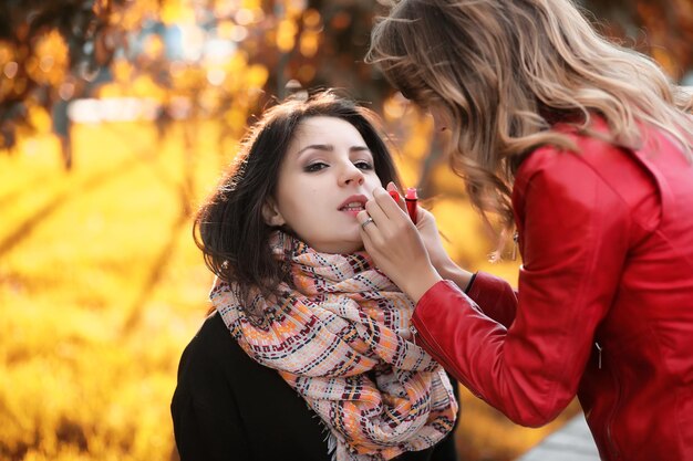 Beautiful girl in the park autumn