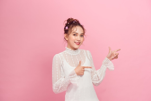 Beautiful girl on a pink background