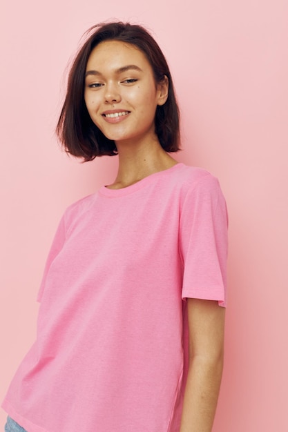 Beautiful girl in a pink Tshirt Youth style pink background