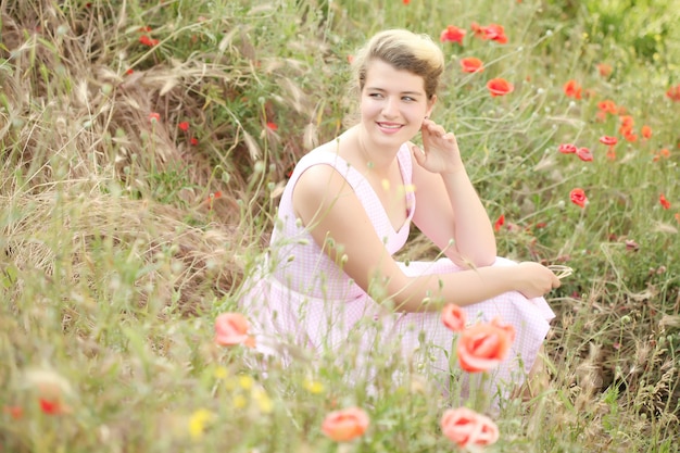 beautiful girl in the poppy field.