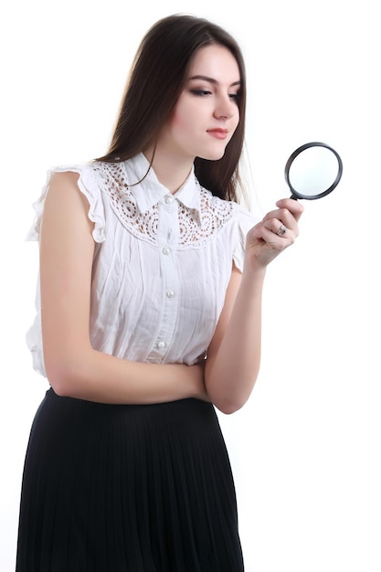 Beautiful girl portrait looking through magnifier Isolated