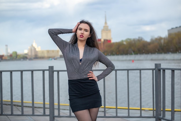 Beautiful girl posing on the pier