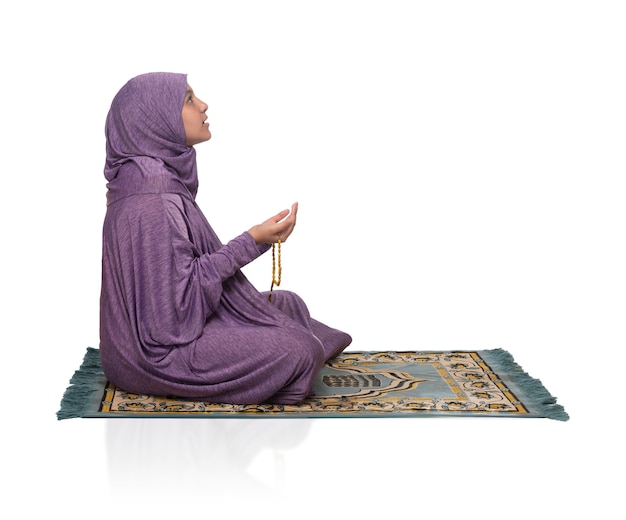 Beautiful Girl Praying on a mat