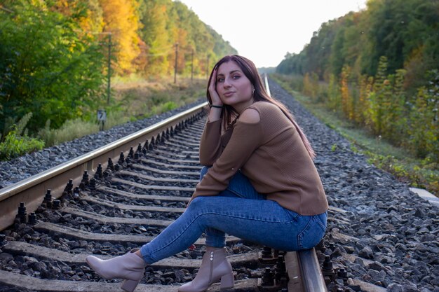 Beautiful girl on the railway track.