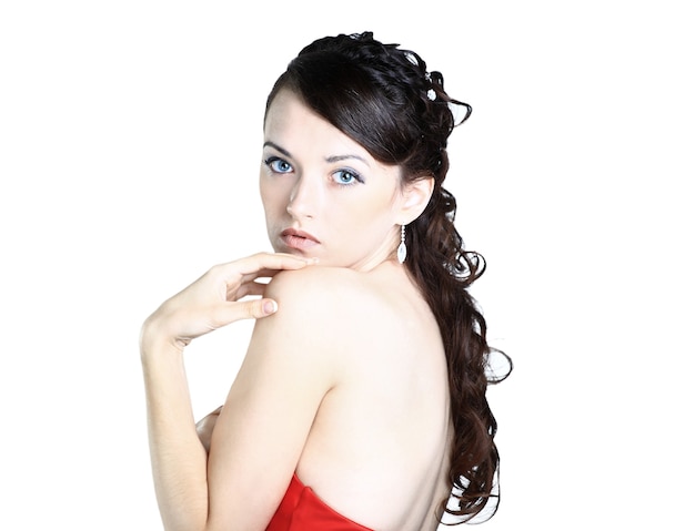 Beautiful girl in the red dress. Isolated on a white background.