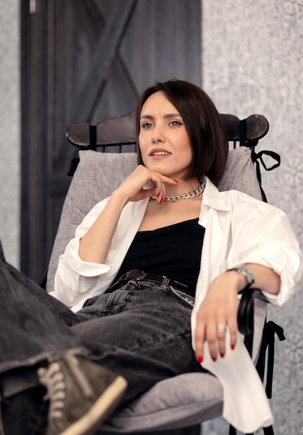 Beautiful girl in a rocking chair enjoys her holiday