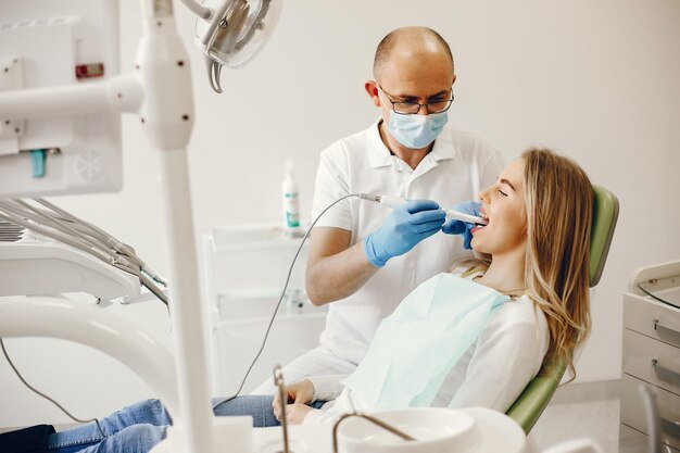 Beautiful girl sitting in the dentists office