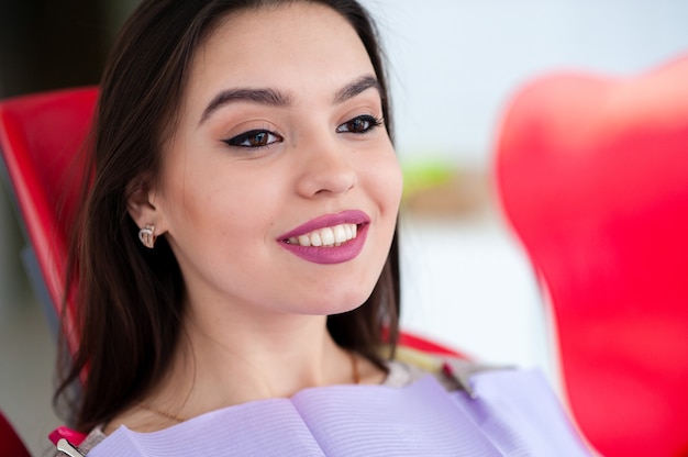 Beautiful girl smiling in the dental chair