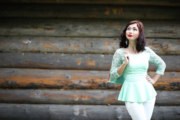 Beautiful girl in a spring leaf park in the afternoon