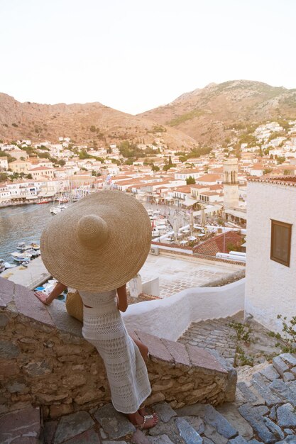 Beautiful girl tourist walking in the streets of Hydra Greece