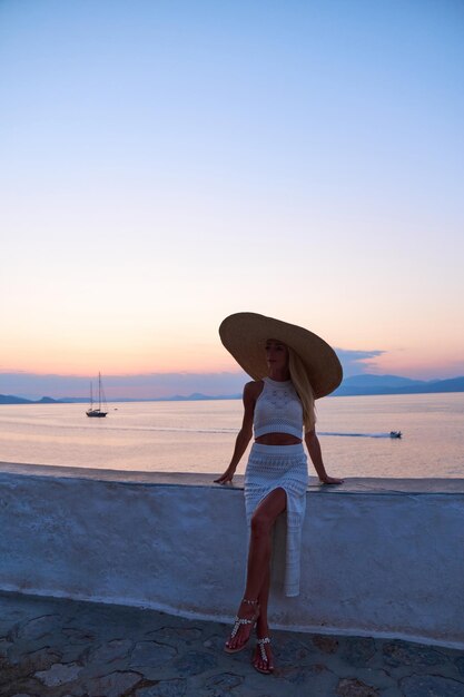 Beautiful girl tourist walking in the streets of Hydra Greece