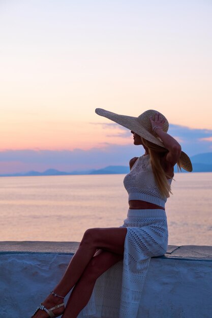 Beautiful girl tourist walking in the streets of Hydra Greece