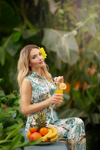 Beautiful girl in a tropical hot country on vacation among palm trees