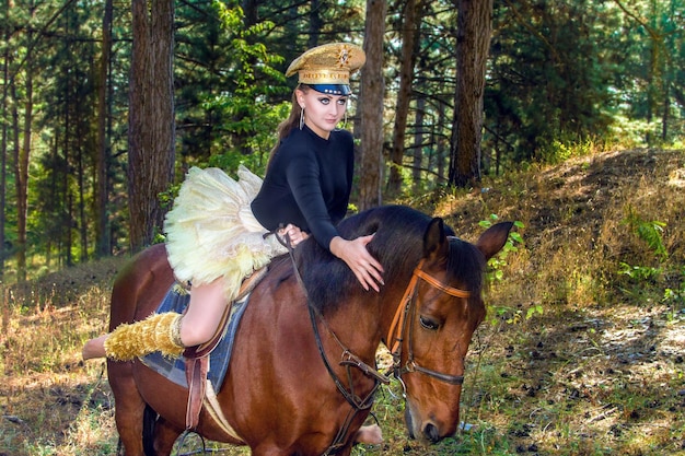 Beautiful girl in uniform on horseback