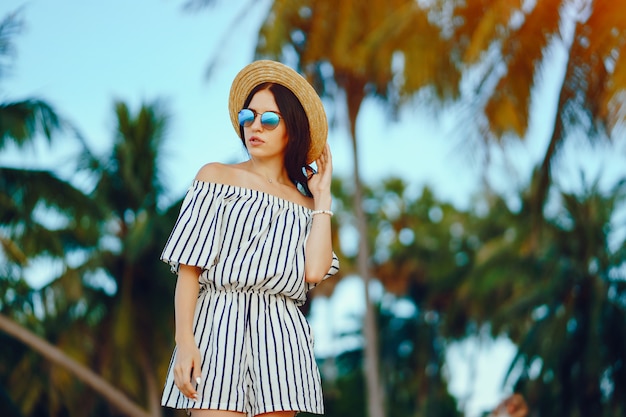 beautiful girl walking along the beach in Thailand