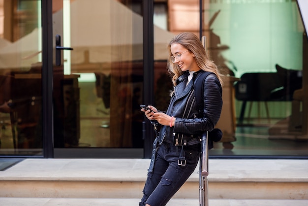 Beautiful girl walking on the street on a sunny day