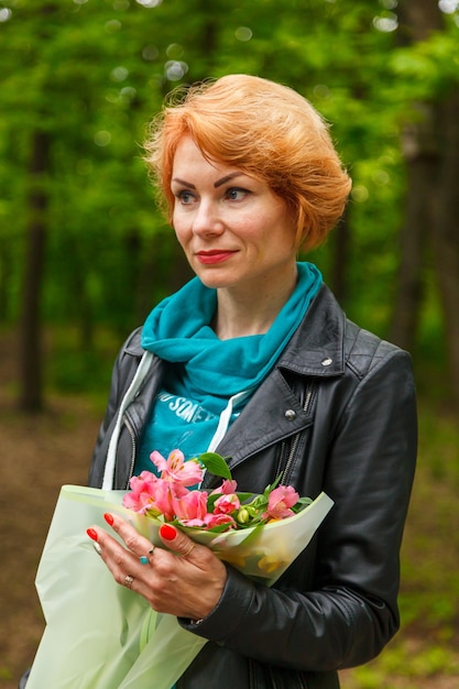 Beautiful girl walking in summer park