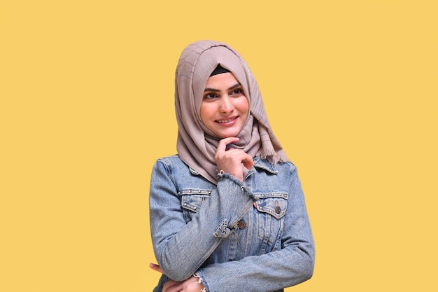 beautiful girl wearing hijab with denim jacket with folded hands indian pakistani model