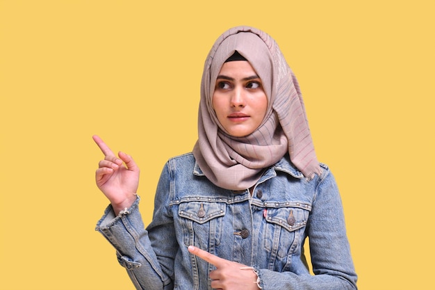 beautiful girl wearing hijab with denim jeans posing away indian pakistani model