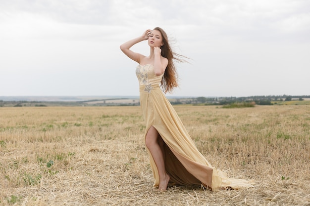 Beautiful girl in a wheat field