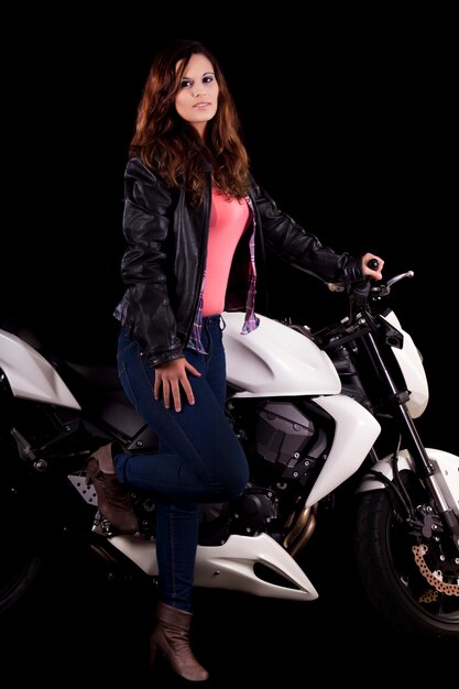 Beautiful girl next to a white motorbike