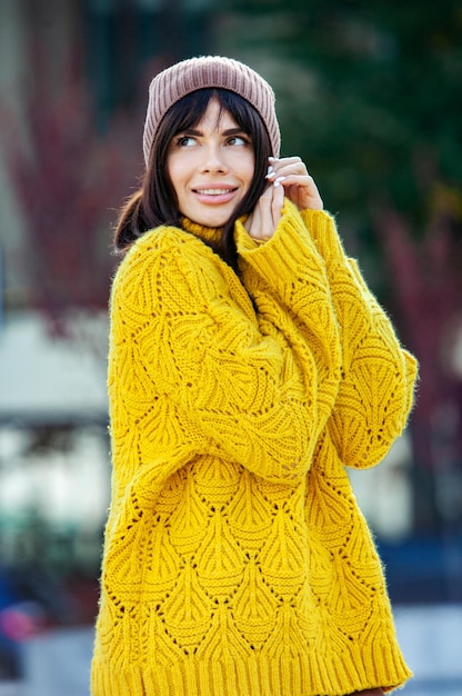 The beautiful girl who wears thick stylish autumn clothes in\
cool weather.