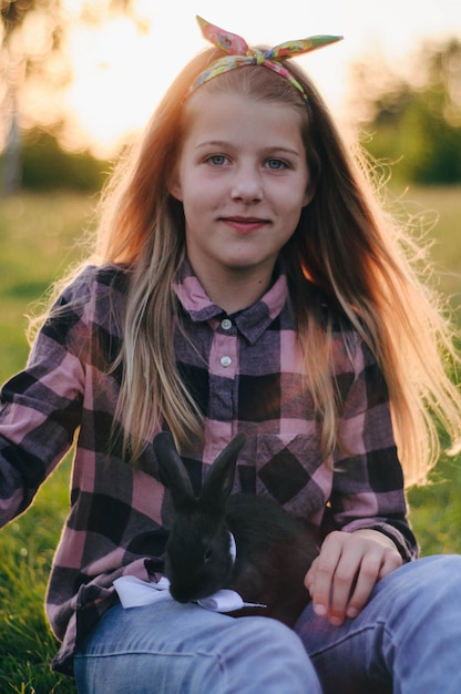 beautiful girl with a black rabbit