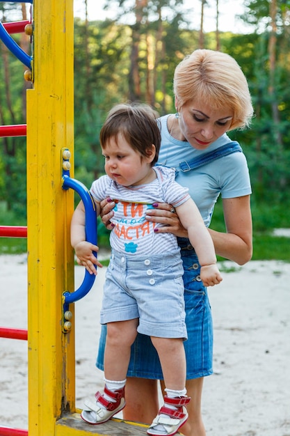 Beautiful girl with children on a children's playground