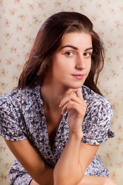 Beautiful girl with flower wall