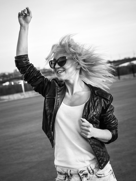 Beautiful girl with glasses posing and smiling