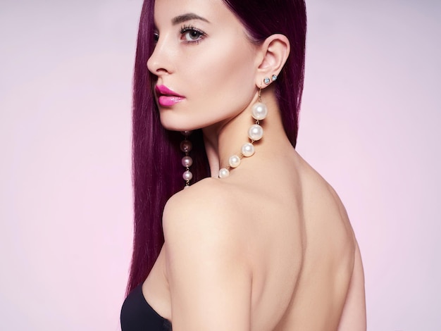 Beautiful girl with jewelry Fashion model with dyed hair